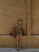 Taupe halter mini dress with draped off-shoulder sleeves, front view on model