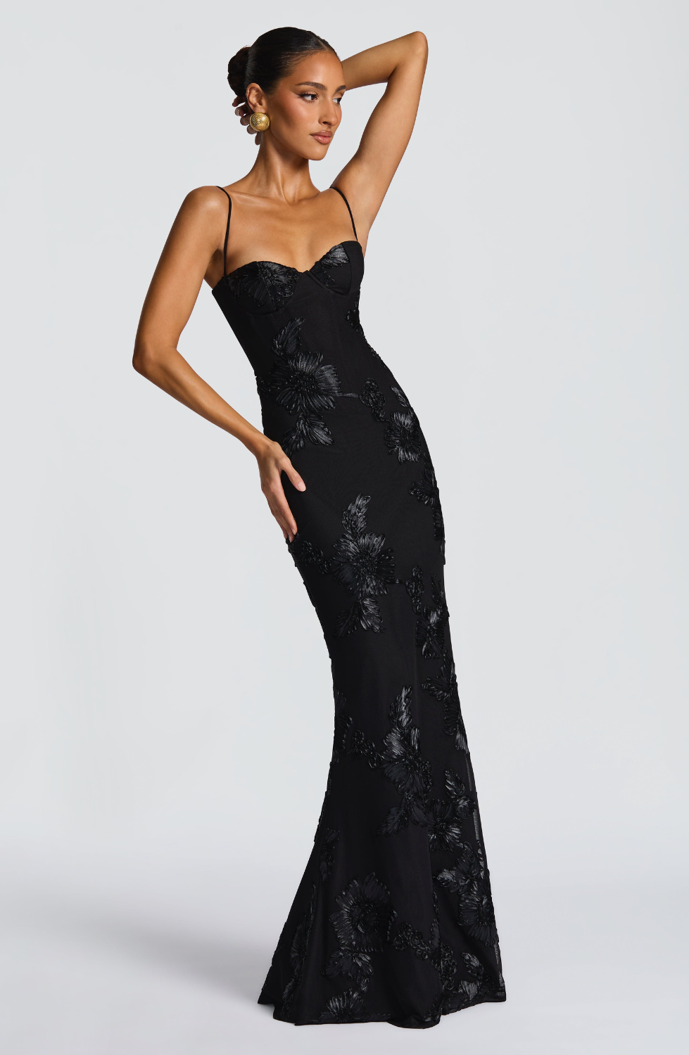 Black fitted maxi dress with floral lace embroidery, alternate side view on model