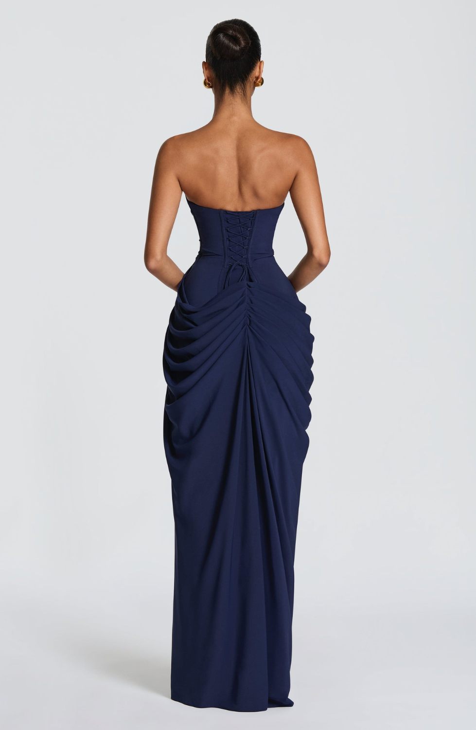 Navy strapless maxi dress with corset lace-up back, back view on model