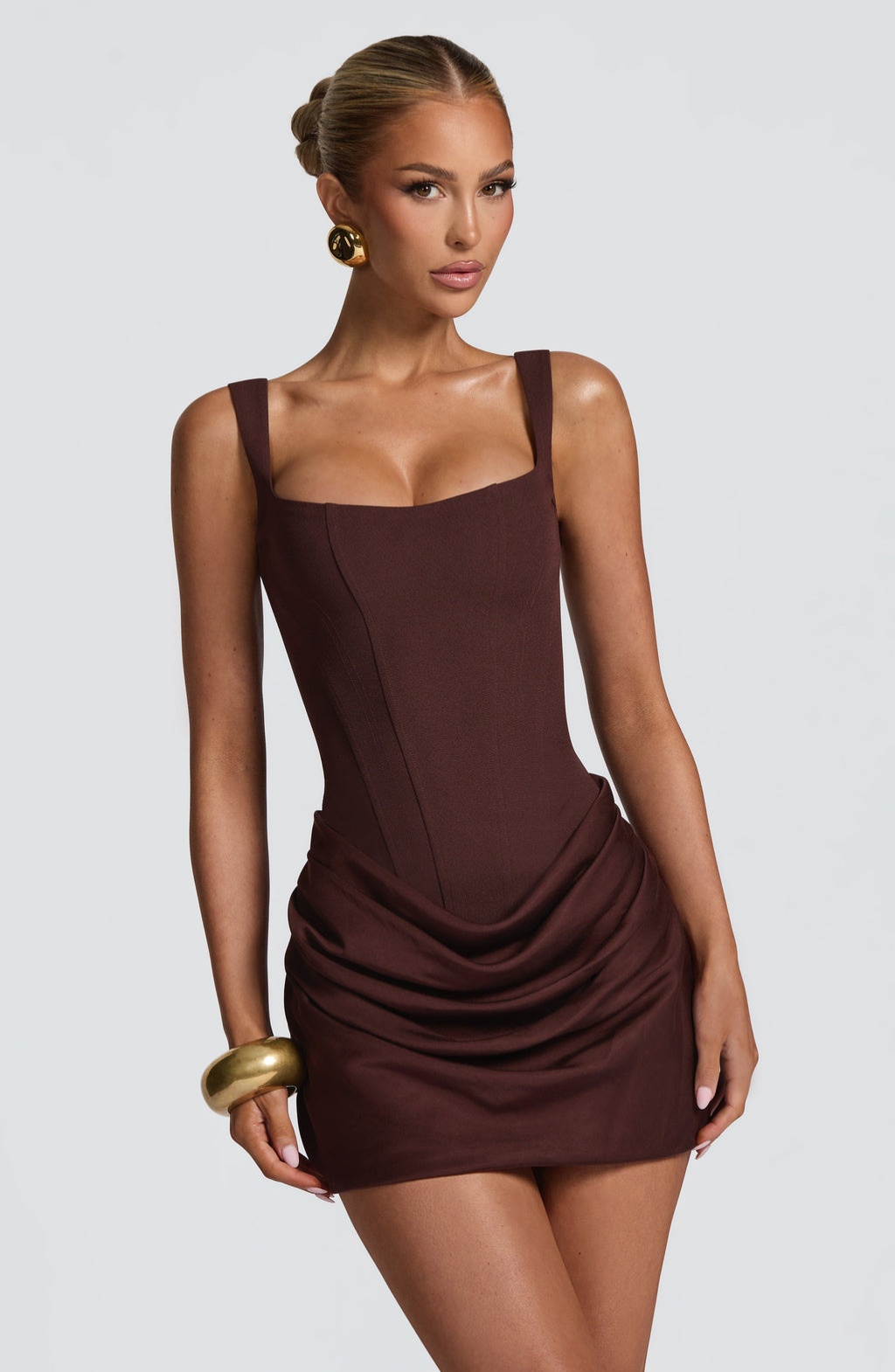 Close-up of mocha corset mini dress bodice on model