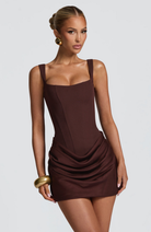 Close-up of mocha corset mini dress bodice on model