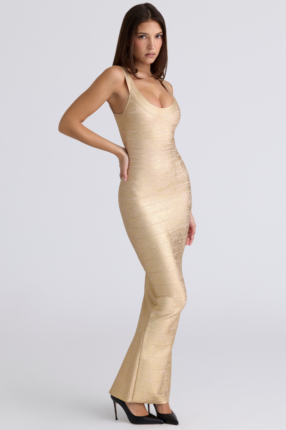 Gold bandage maxi dress with scoop neck, side angle view on model