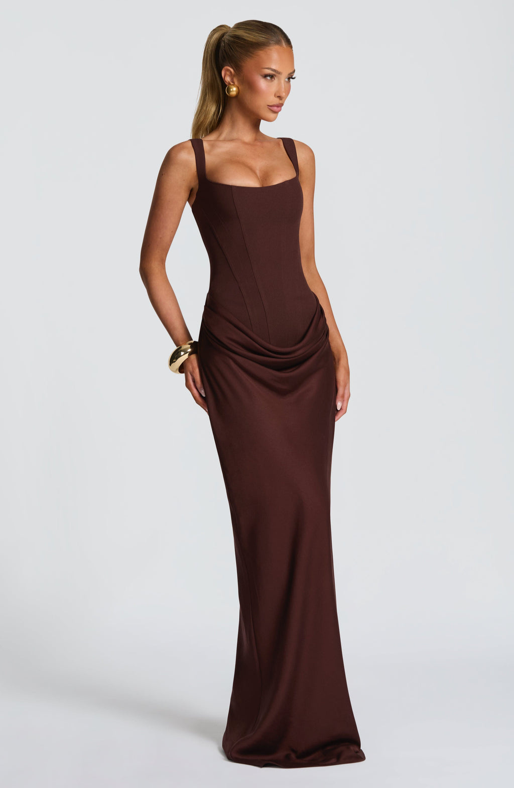 Mocha corset-style maxi dress on model, side view