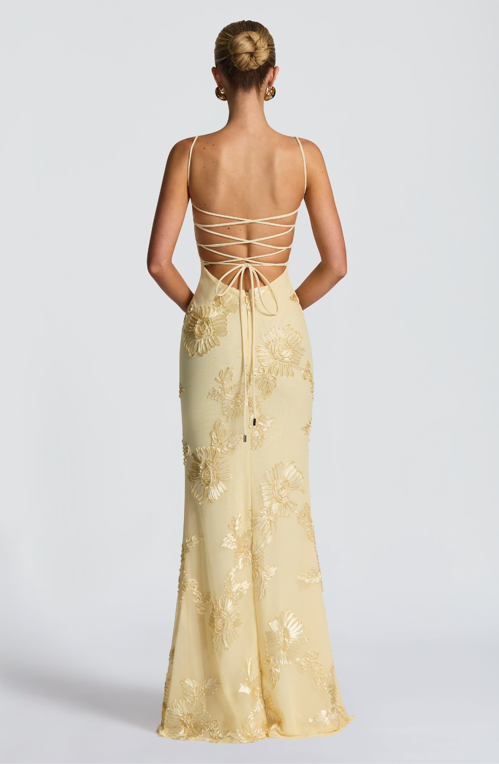 Lemon fitted maxi dress with lace-up open back, back view on model