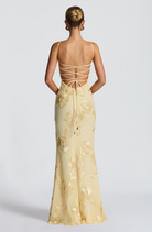 Lemon fitted maxi dress with lace-up open back, back view on model