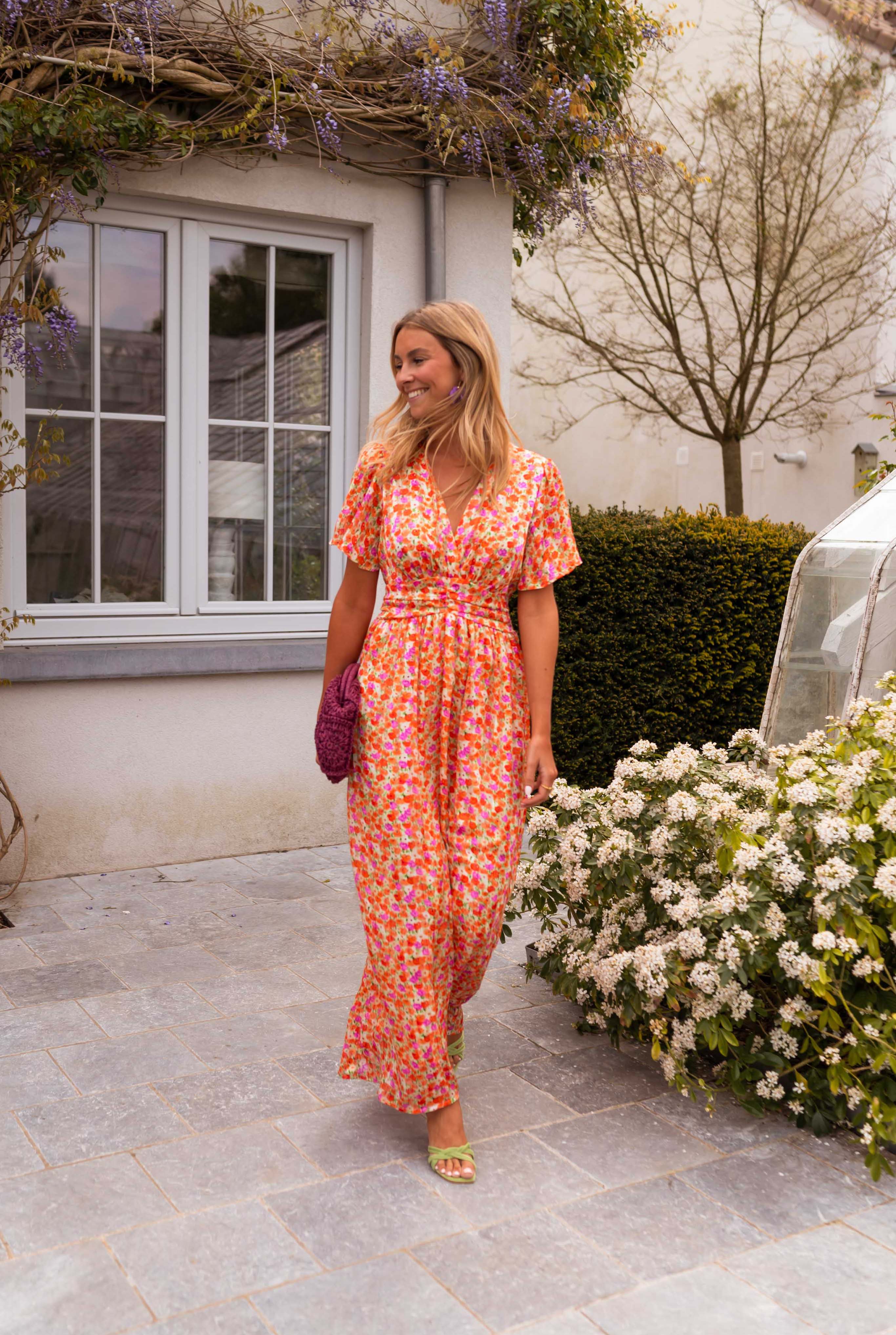 Orange floral print maxi dress, walking front view on model