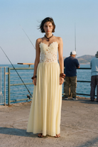Butter lace maxi dress, front view on model on a pier