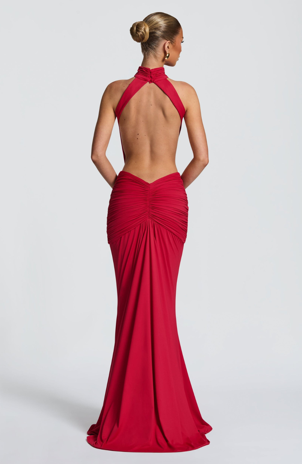 Red backless maxi dress with halter neck, back view on model