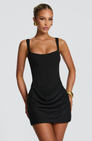 Black corset mini dress with ruched skirt, front view on model