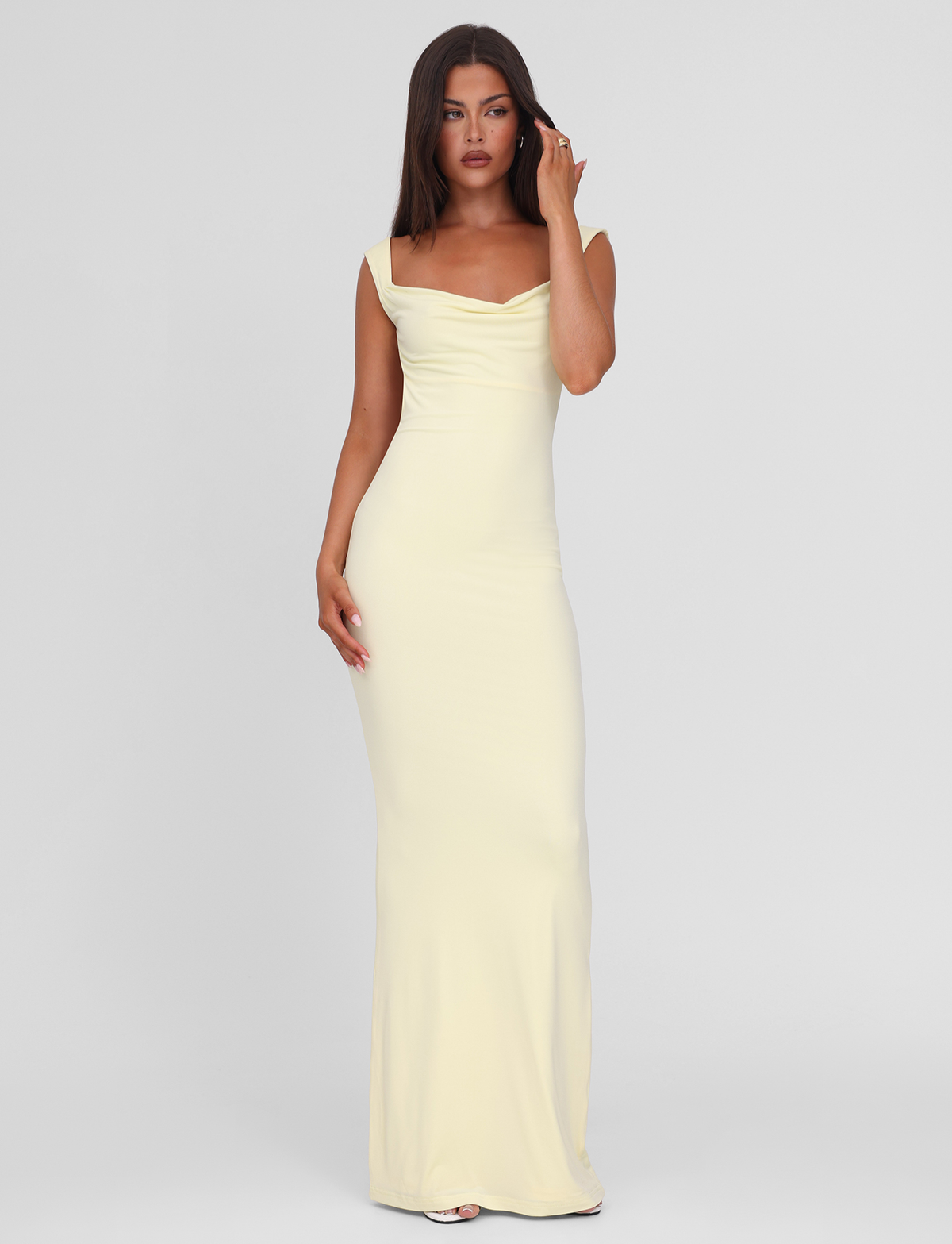 Lemon yellow maxi dress, front view with hand near face