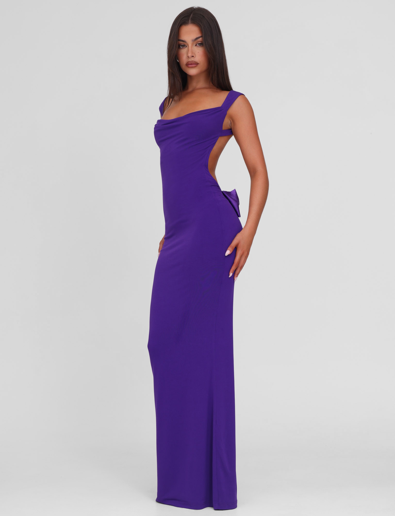 Purple maxi dress with side bow cutout, side view on model