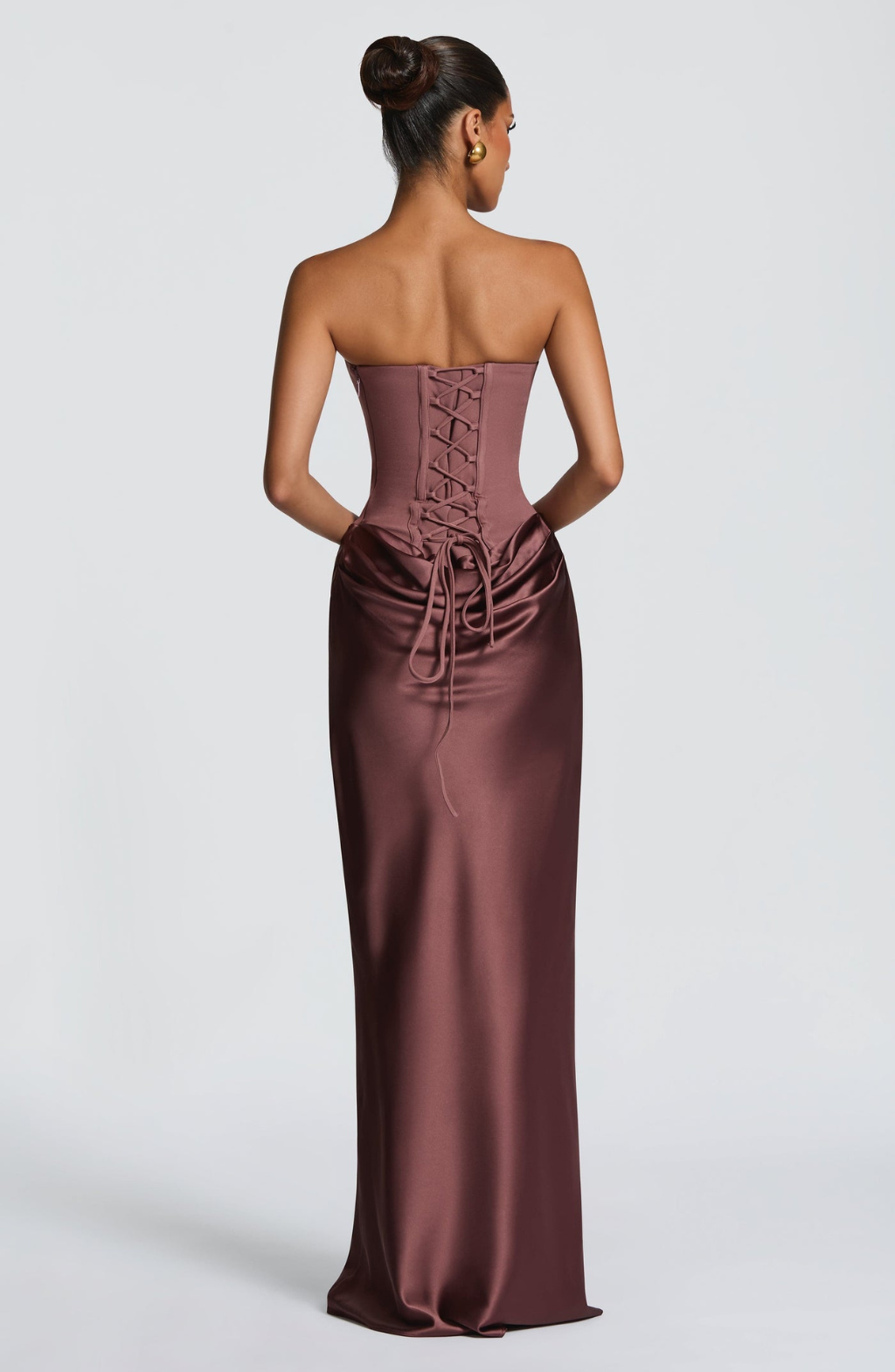 Back view of mocha satin maxi dress showing lace-up corset back