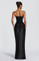Back view of black satin maxi dress showing lace-up corset back