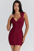 Wine bandage mini dress with V neckline, close angled view on model