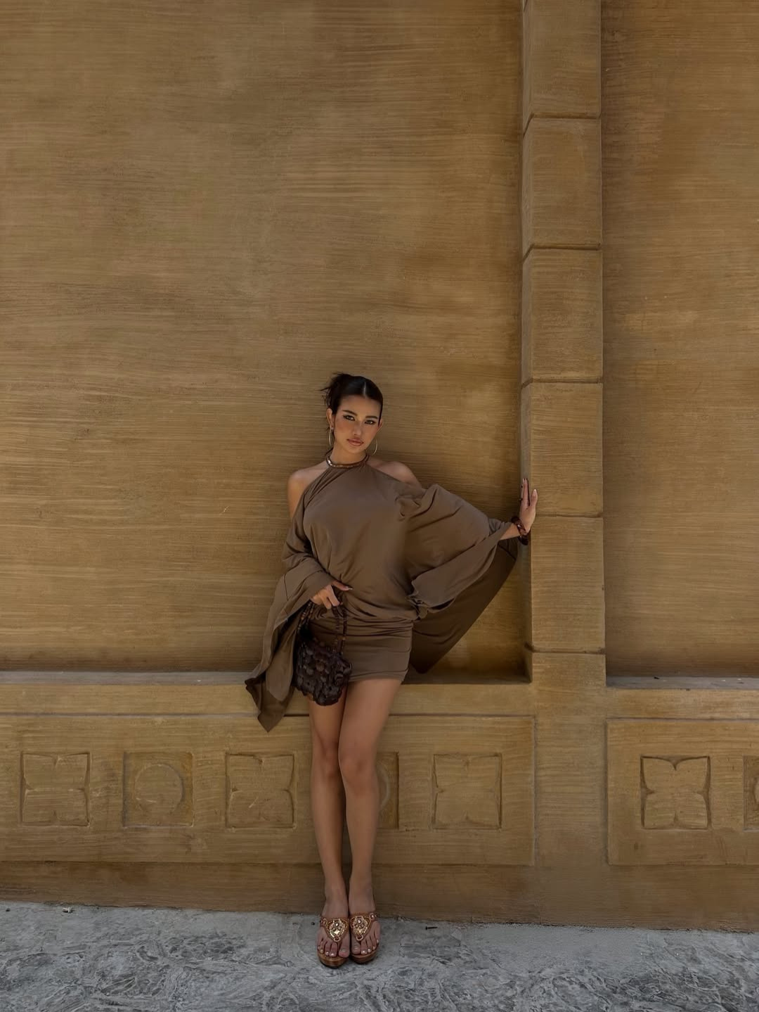 Taupe mini dress with draped batwing sleeve, front view on model