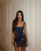 Navy sequin mini dress with gold embroidery, full front view indoors