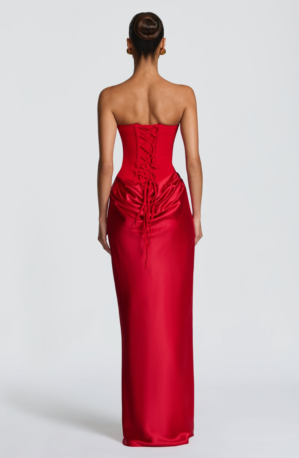 Back view of red satin maxi dress showing lace-up corset back