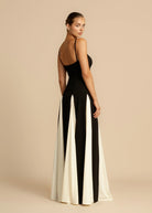 Black maxi dress with ivory godets, back and side view on model