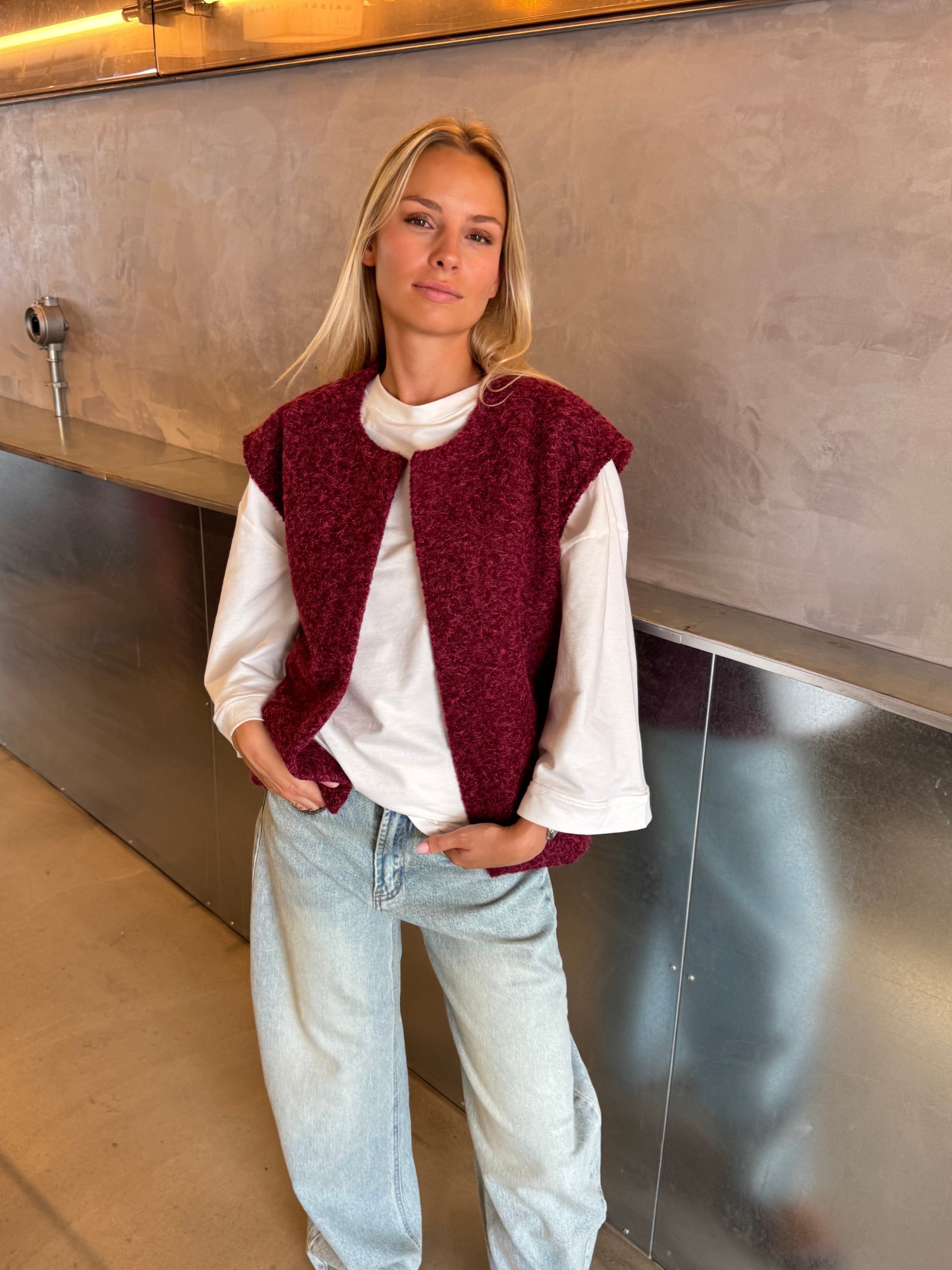 Burgundy bouclé knit vest on model, full length front view