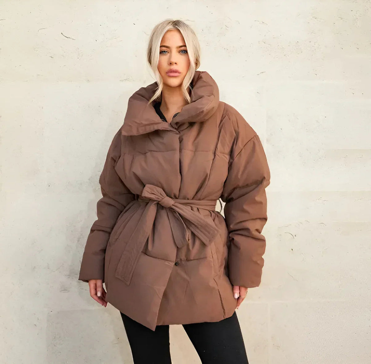 Brown belted puffer jacket, studio front view on model