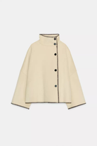 Cream wool jacket with contrast stitch edging, flat lay