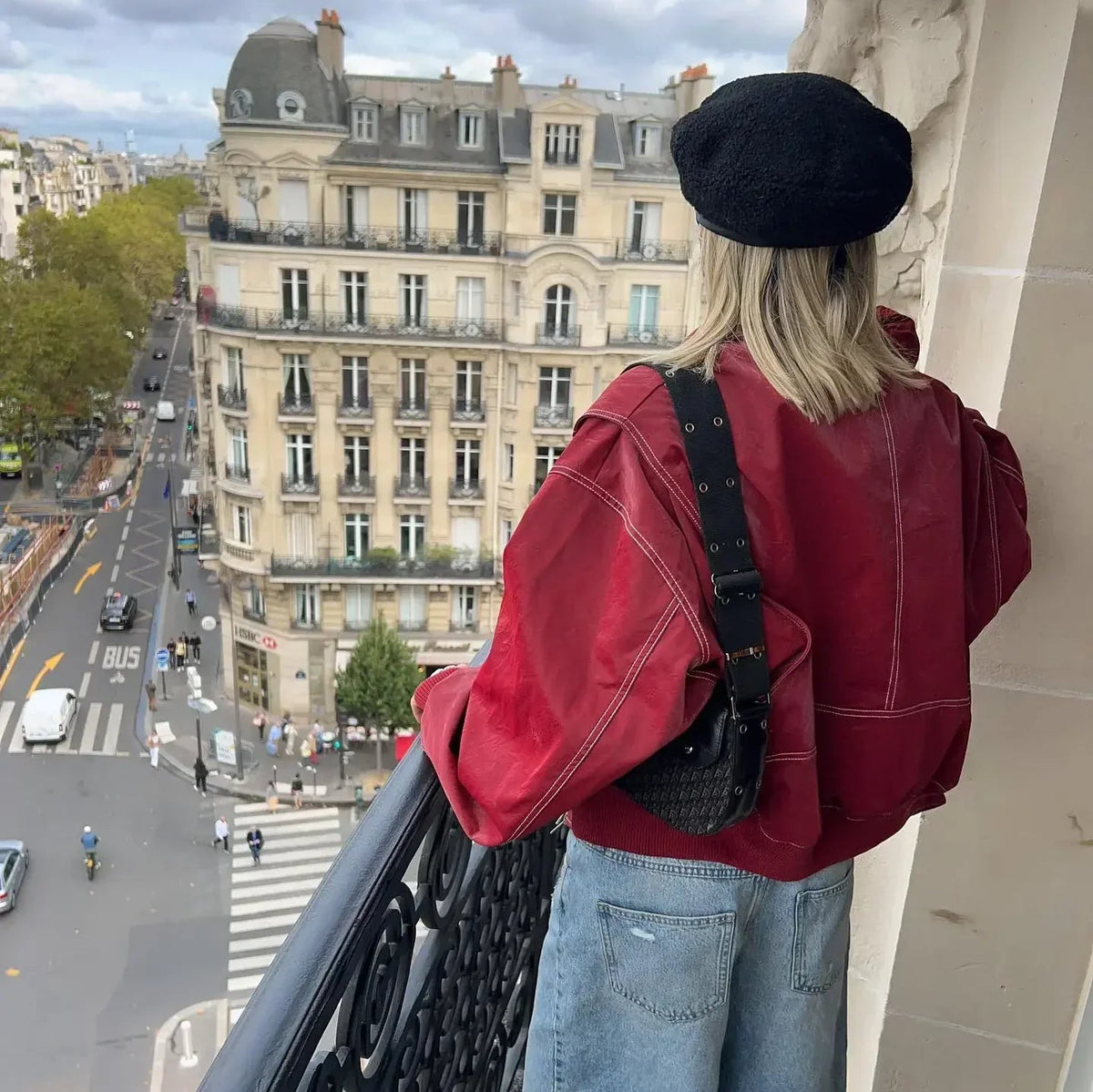 Red oversized contrast-stitch jacket, back view on balcony