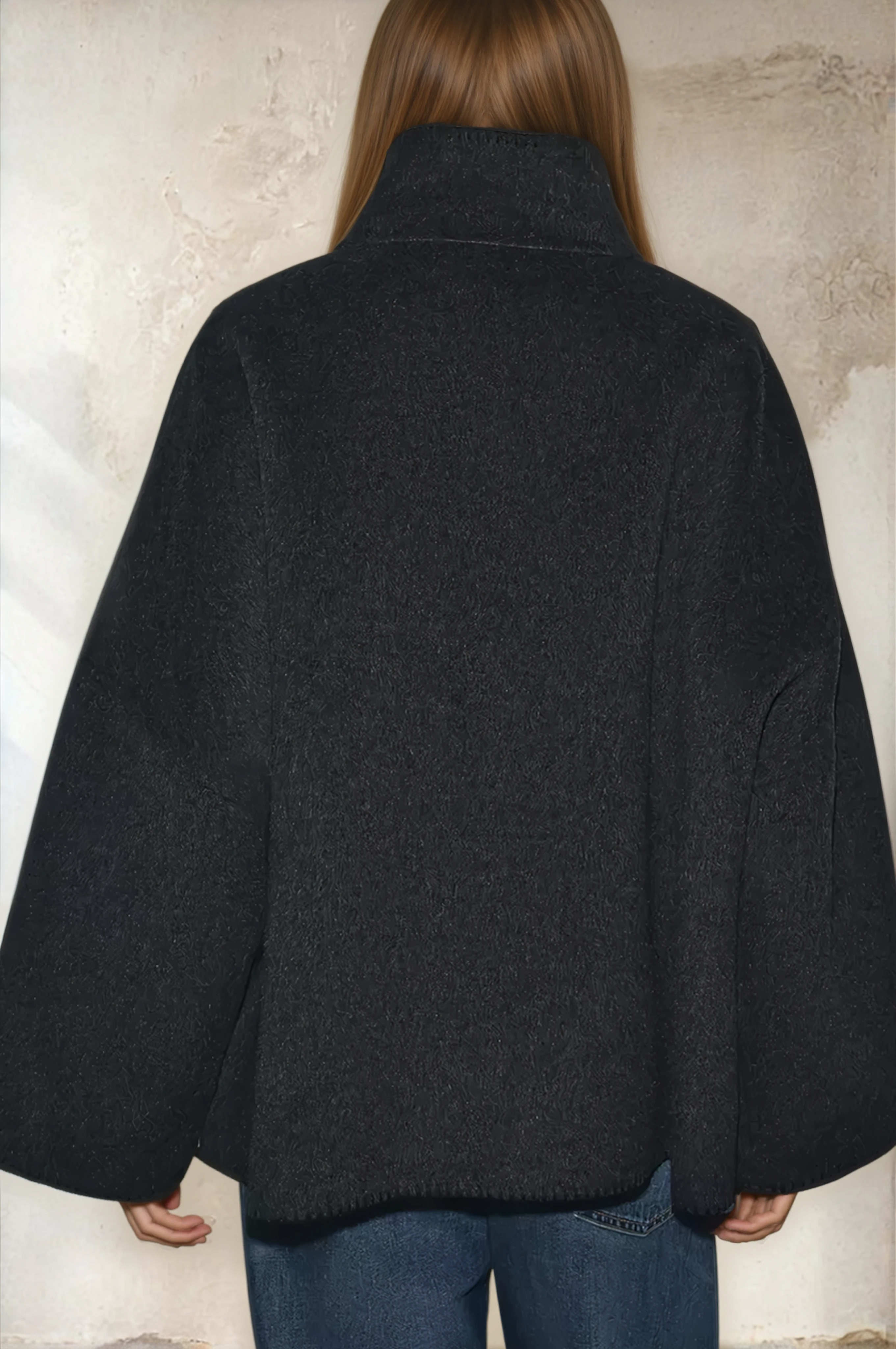 Dark grey cropped wool jacket on model, back view