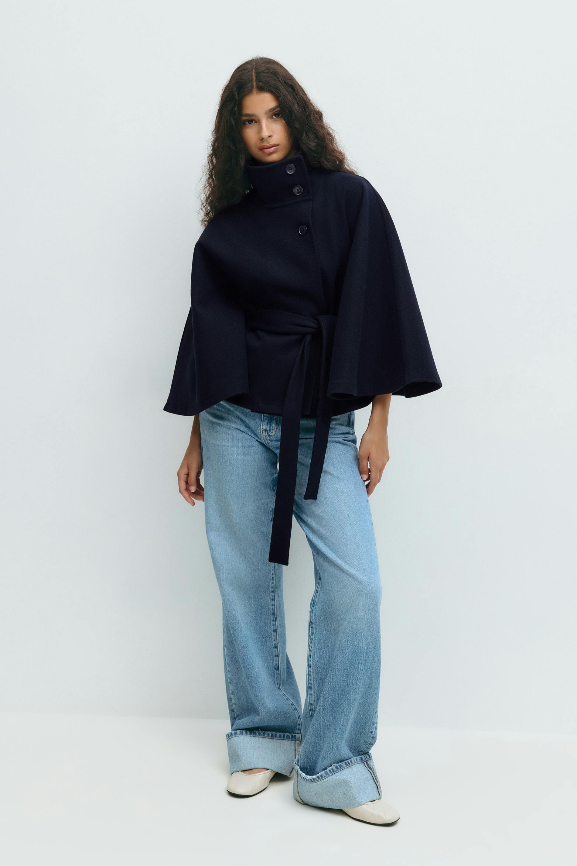 Midnight blue belted cape jacket, full length front view on model