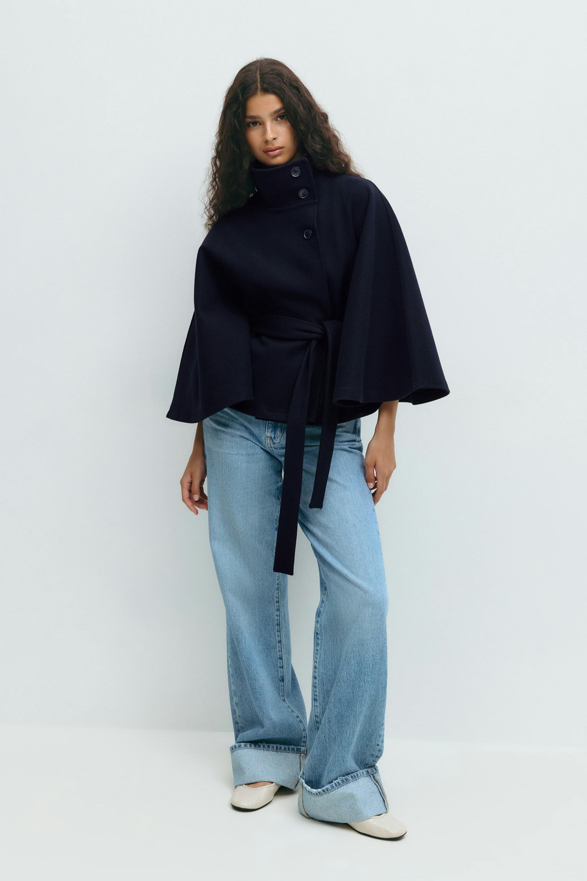 Midnight blue belted cape jacket, full length front view on model