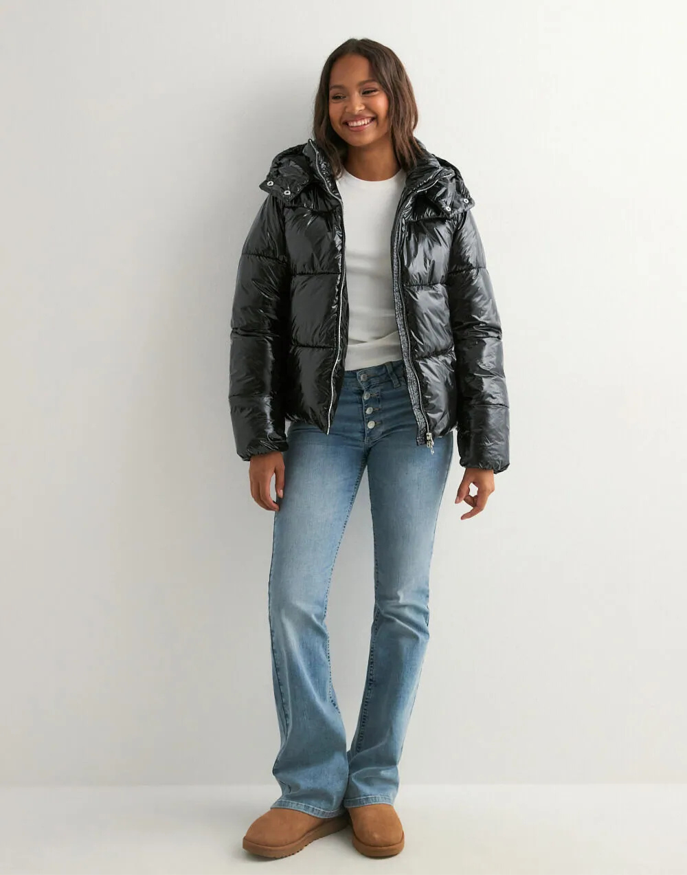 Black glossy hooded puffer jacket, full-length front view unzipped