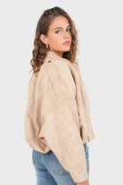Beige suede bomber jacket, back view close-up on model