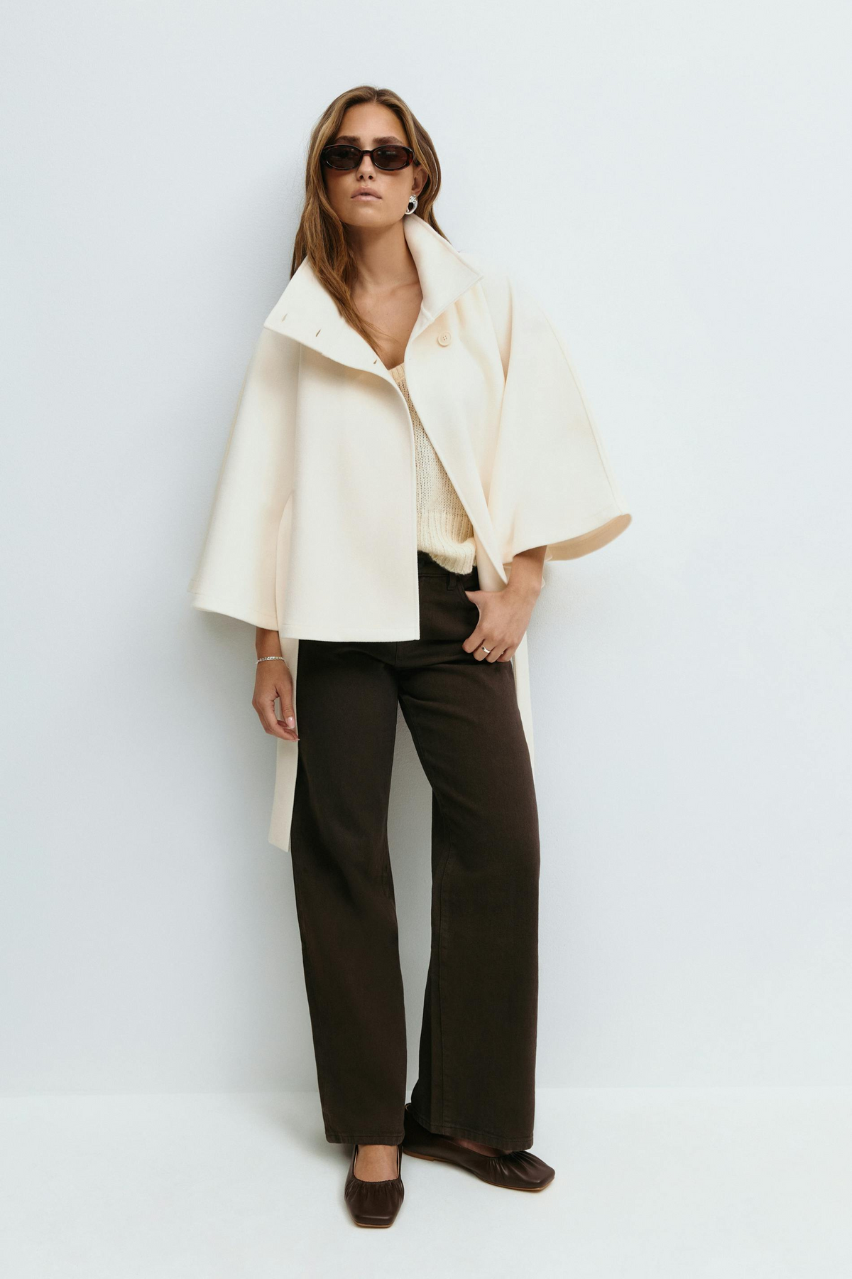 White belted cape jacket, full length front view on model