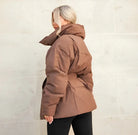Brown belted puffer jacket, side and back view on model