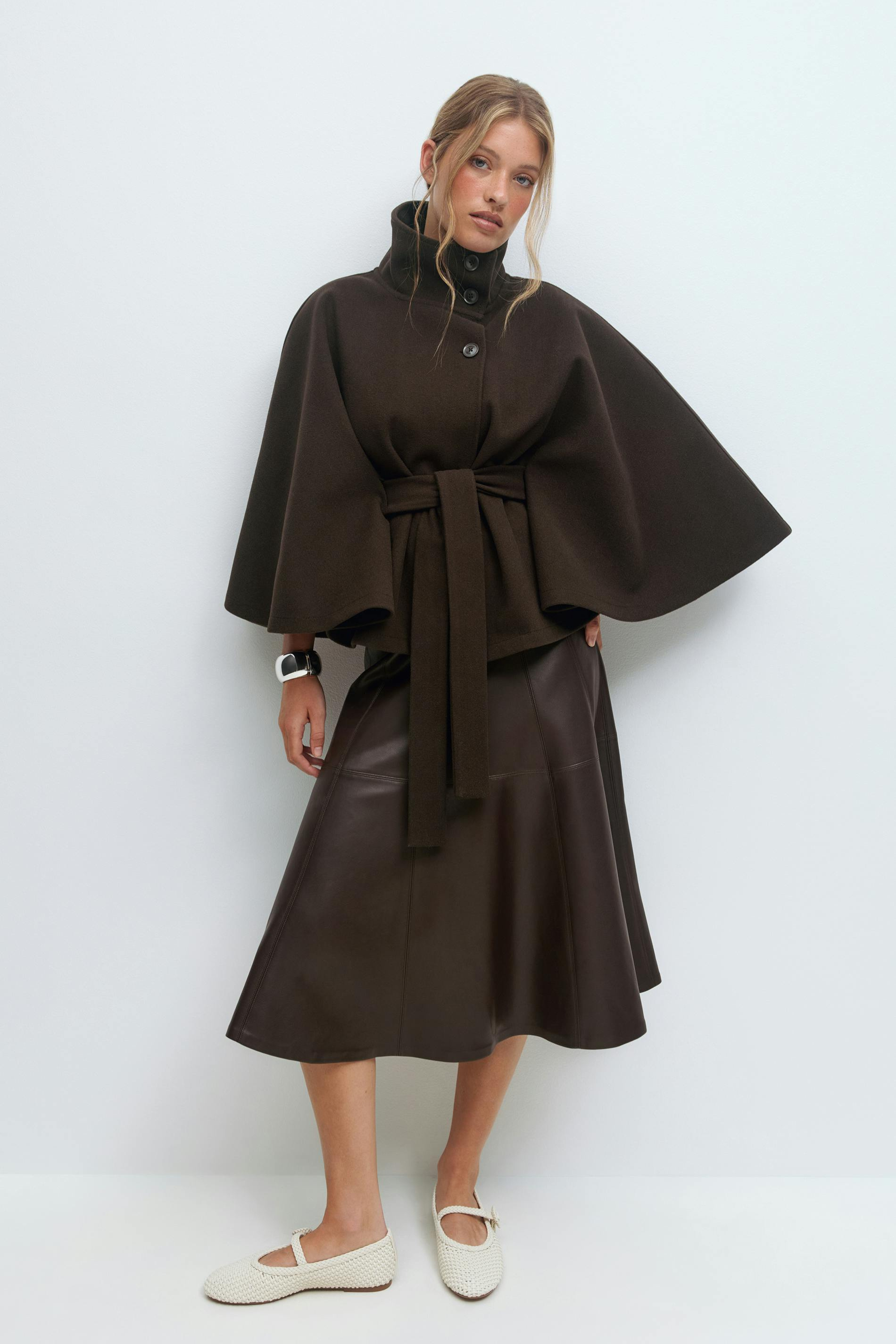Brown belted cape jacket, full length front view on model