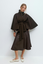 Brown belted cape jacket, full length front view on model
