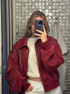 Red oversized contrast-stitch jacket, mirror selfie