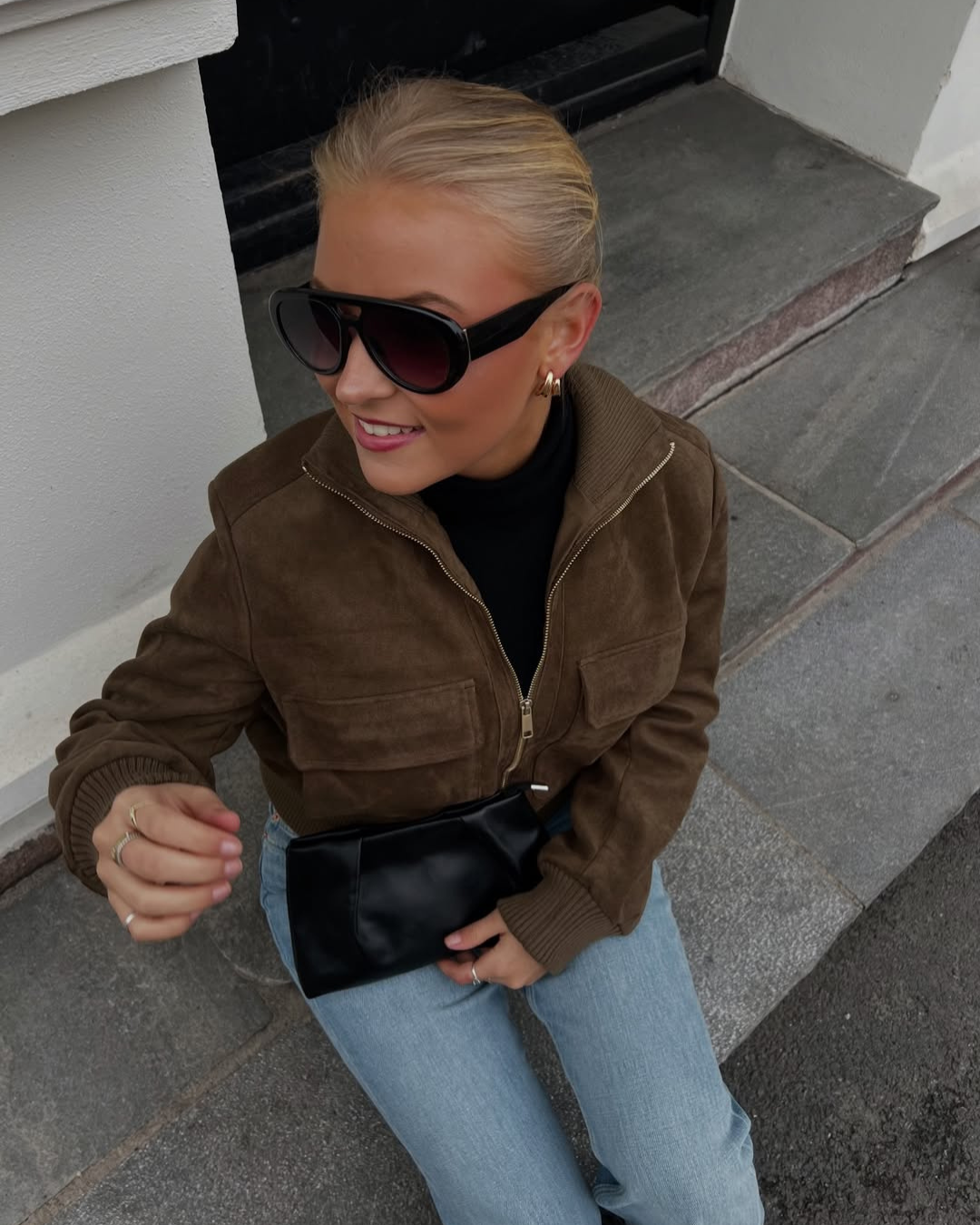 Brown suede bomber jacket with zip and flap pockets, front view