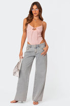Grey wide-leg jeans, front view on model with pink top