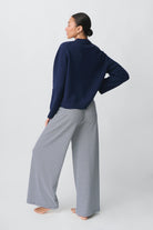 Navy and white striped wide-leg trousers, back view on model