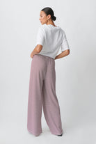 Red and white striped wide-leg trousers, back view on model