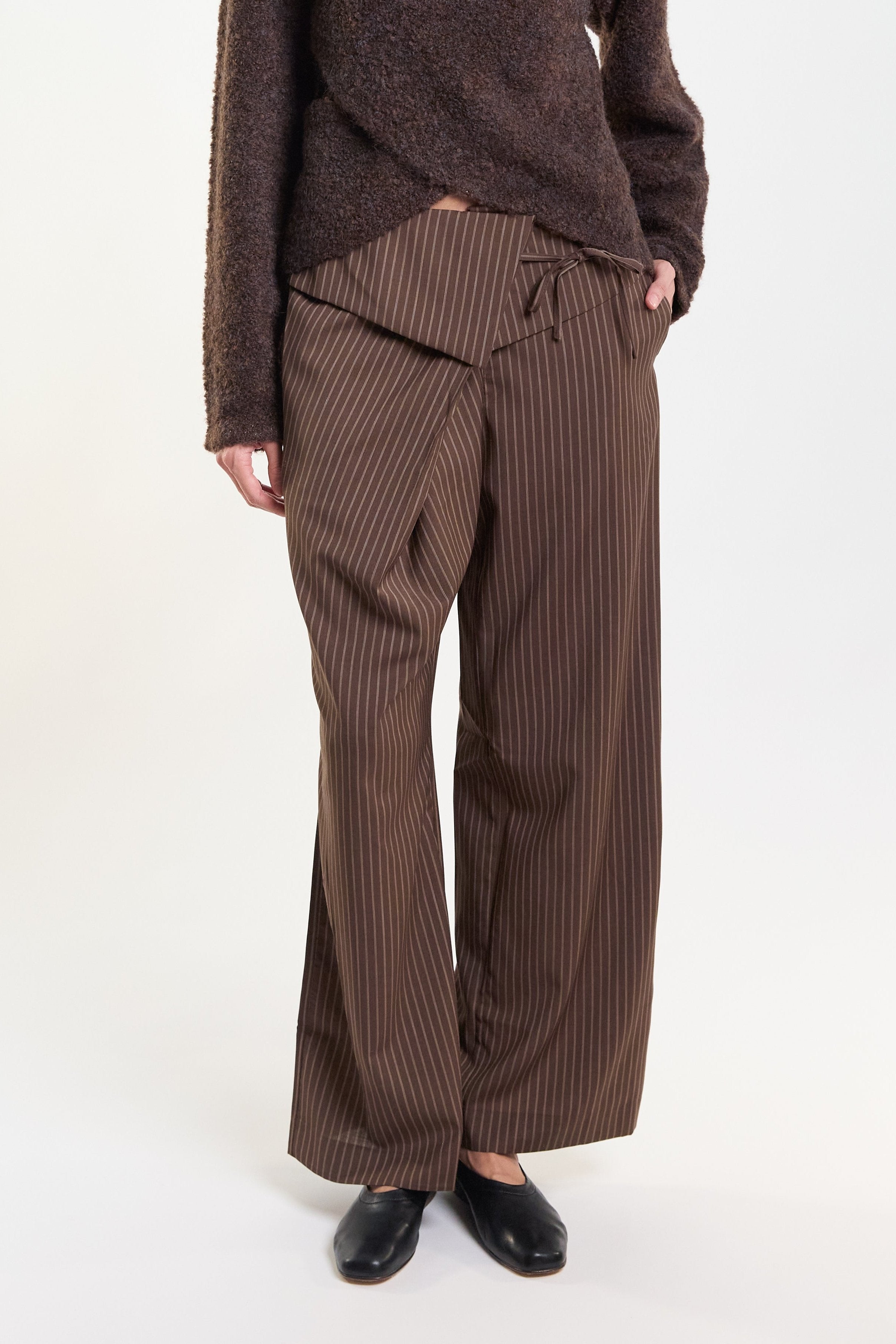 Brown pinstripe wrap-front tailored trousers, front view on model
