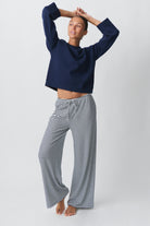 Navy and white striped wide-leg trousers, front view on model