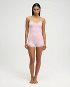 Soft pink lace-trim romper, full length front view on model