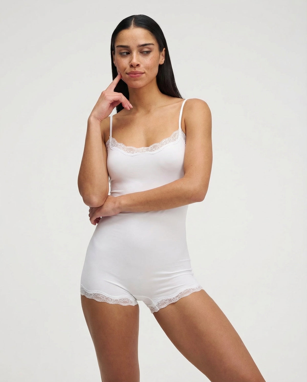 White lace-trim romper, front view on model