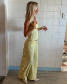 Yellow stripe top and wide-leg trousers set, side view on model