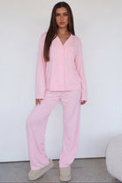 Pink long-sleeve pyjama set with trousers, full length front view