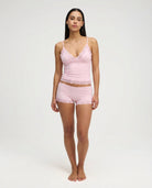 Soft pink lace-trim pyjama set, full length front view on model