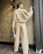 Beige oversized hoodie and joggers set, back view on model