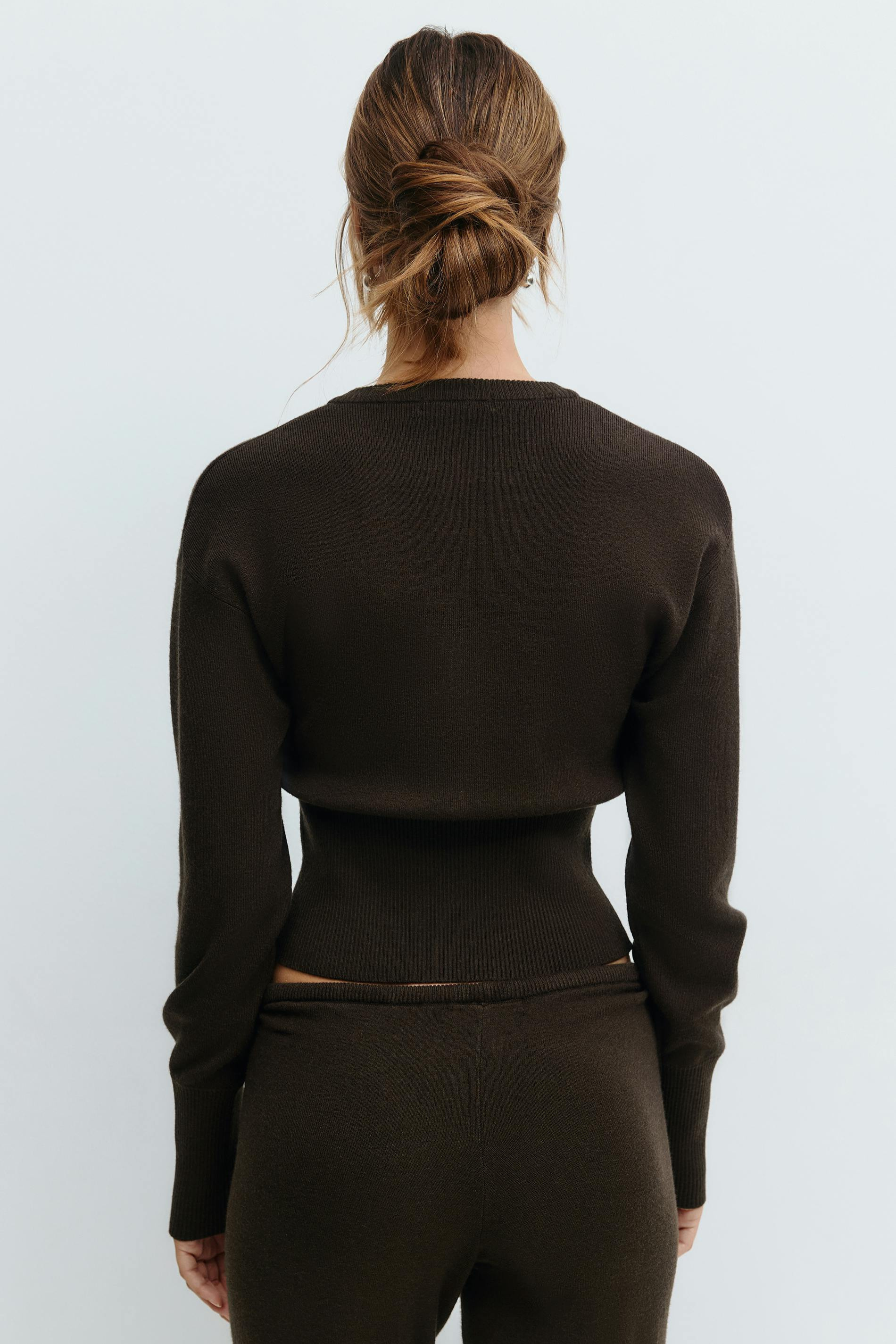 Brown knitted cardigan and trousers set, close crop back view