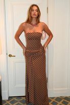 Cocoa dot corset top and wrap maxi skirt, front view with hands on hips